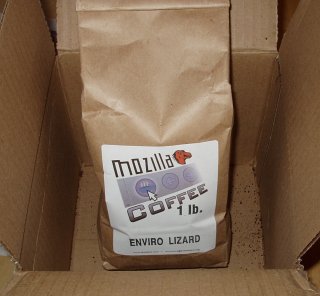 An open box containing a bag of Mozilla Coffee.