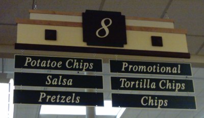 Store aisle proclaiming 'Potatoe Chips'