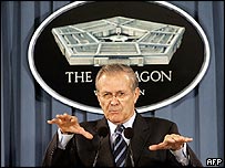 AFP photo of Donald Rumsfeld holding his hands out.