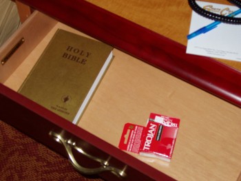 In the bedside drawer in our hotel room: A Gideon bible and a Trojan condom box