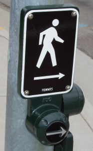 Walk button with raised arrow.