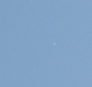 Small bright object in the daytime sky.