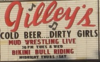 Sign: Cold Beer... Dirty Girls. Mud Wrestling Live... Bikini Bull Riding.