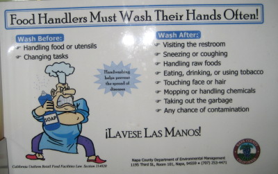 Angry cartoon chef on a WASH YOUR HANDS! sign with a whole lot of specifics and exclamation marks.