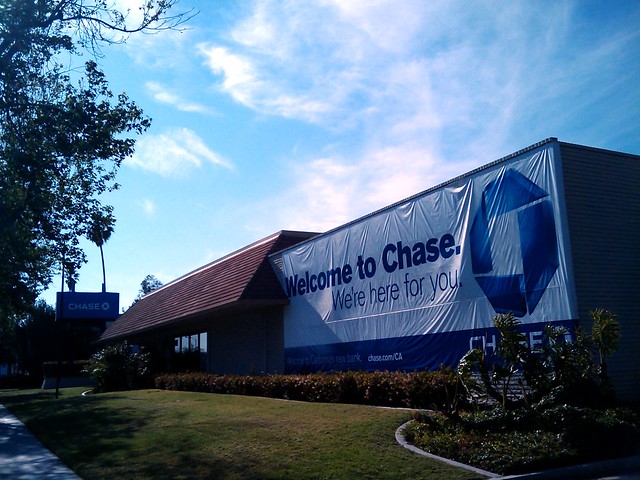 Banner on what was a Washington Mutual bank, now showing Welcome to Chase. We're Here For You.