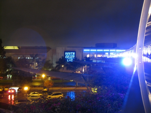 A bright light at the edge of the photo oversaturates this view of a mall.