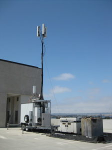 Portable cellular phone tower on wheels.