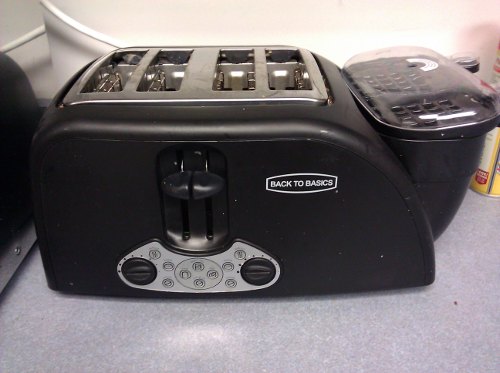 Toaster labeled 'Back to Basics' with 5,000 buttons and an extra...something.