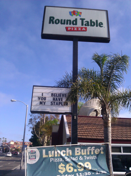 Round Table Pizza sign: I Believe You Have My Stapler