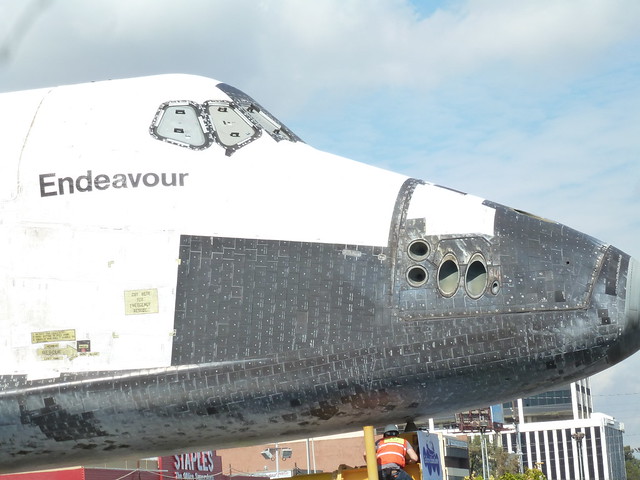 The windows and heat tiles of the shuttle's nose.