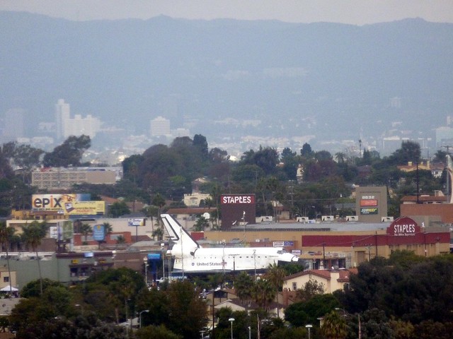 Clearer view of the Shuttle in a parking lot, still from a distance.