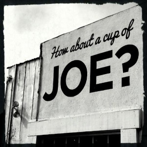 Sign on a wall: How about a cup of joe?