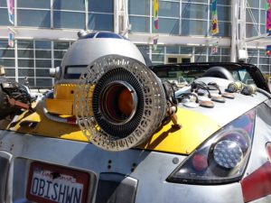 Close-up of the OBISWHN customized car with R2D2 and thrusters.