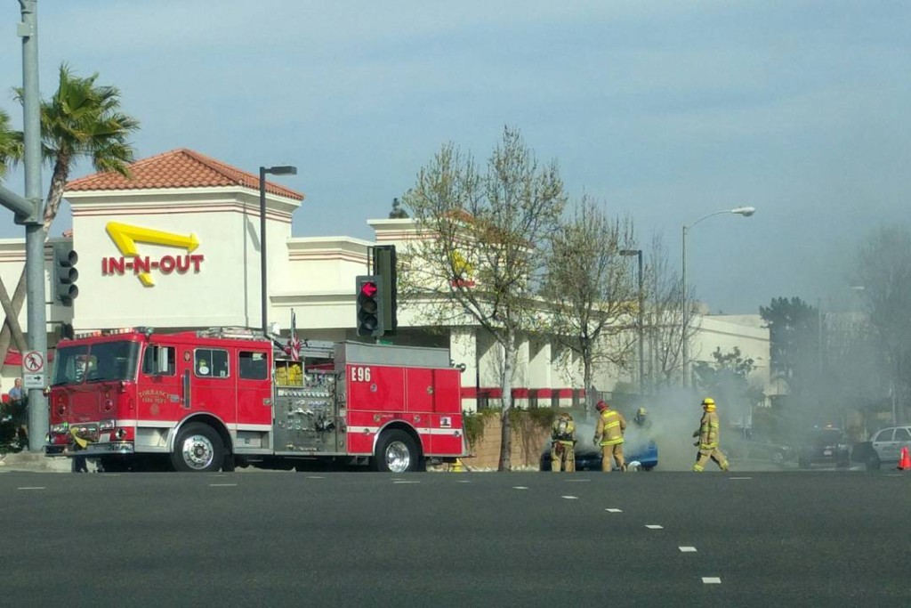 Car fire and fire engine in front of In-N-Out