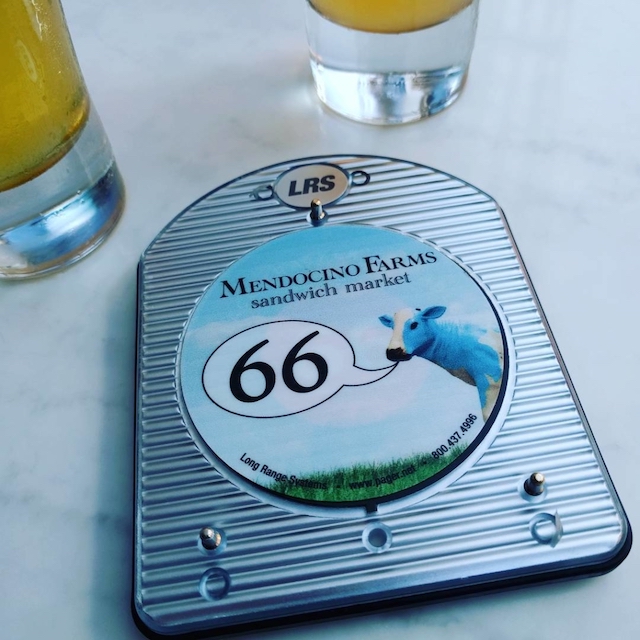 Restaurant pager labeled 66.