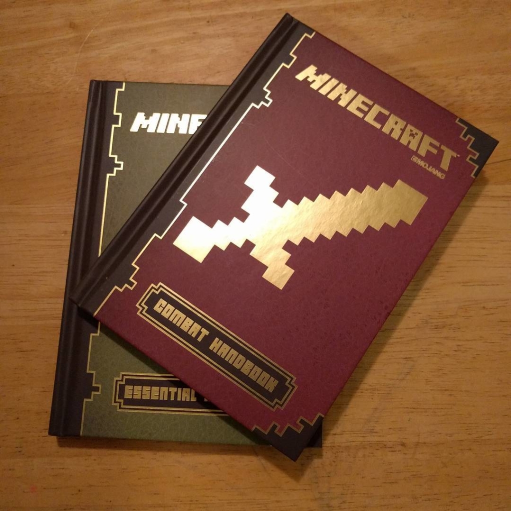 A pair of Minecraft reference books.