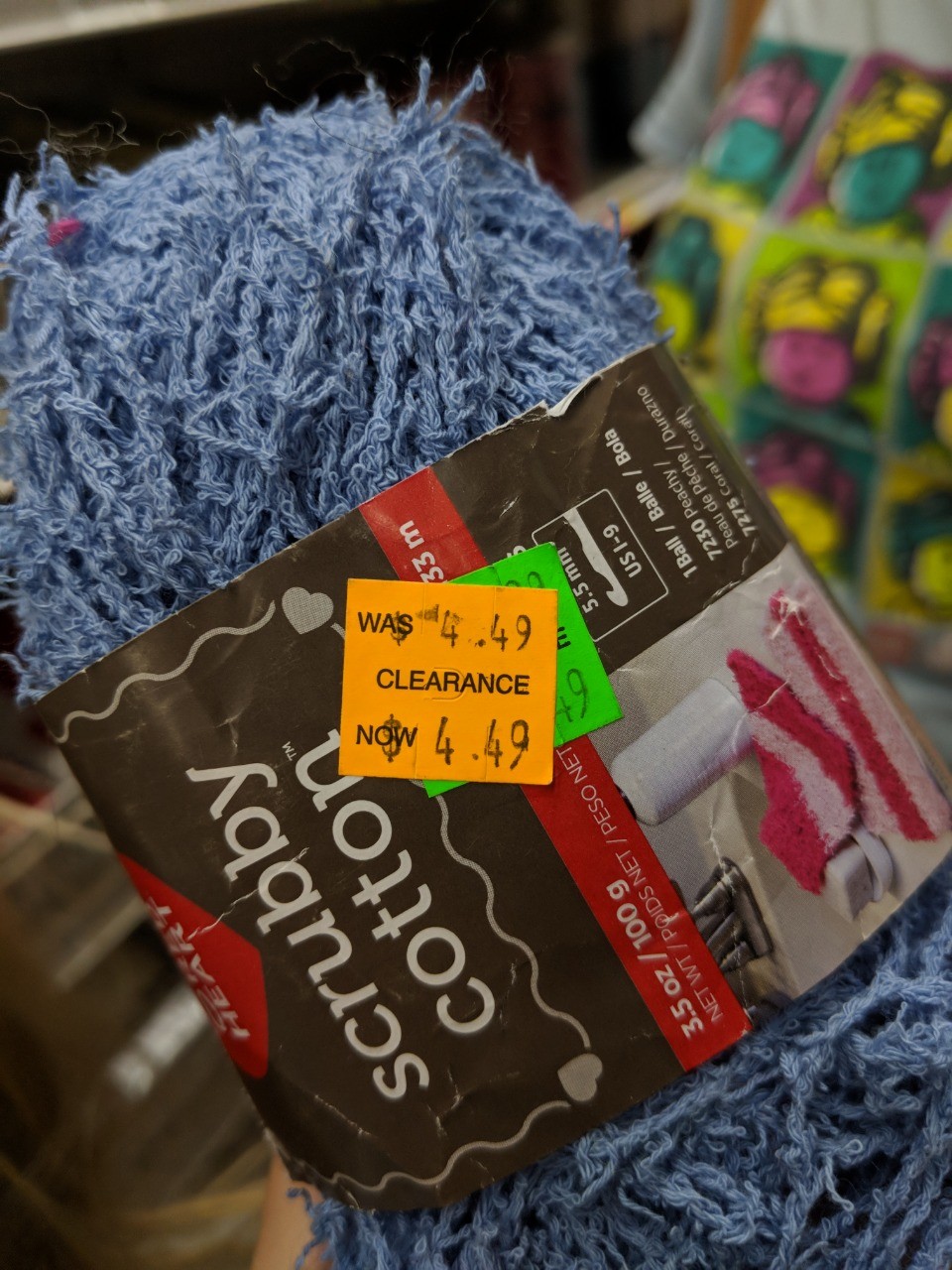 Ball of yarn with a price tag: Clearance! Was 4.49. Now 4.49.
