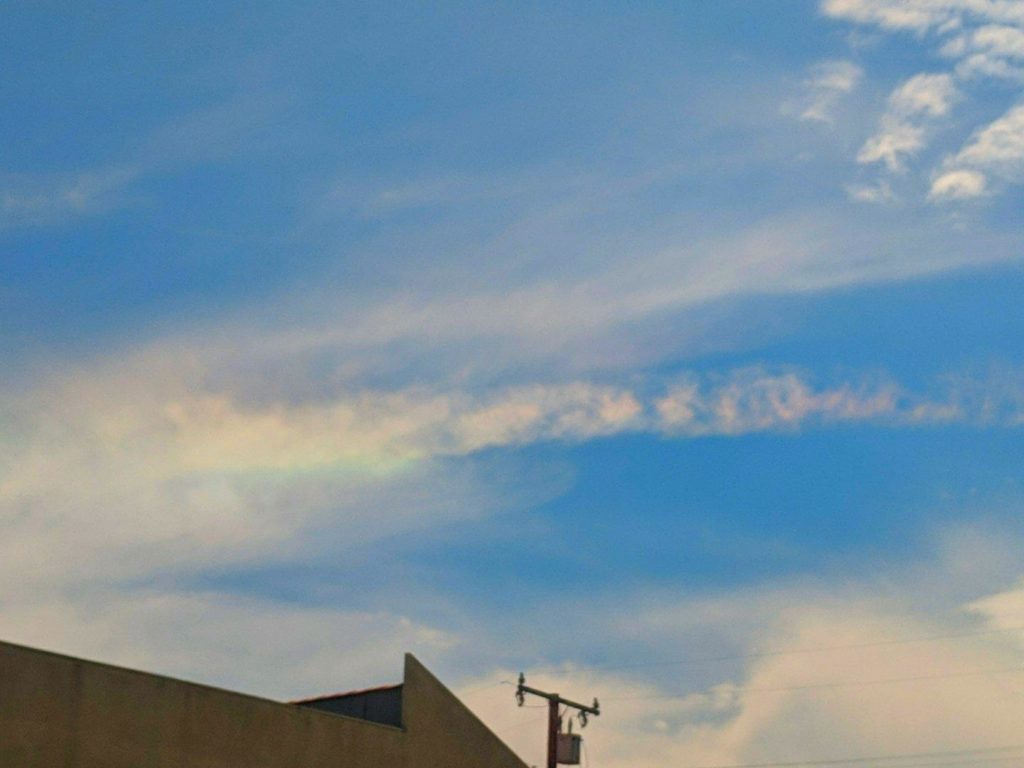 Smudgy clouds, colors enhanced to bring out a straight rainbow effect.