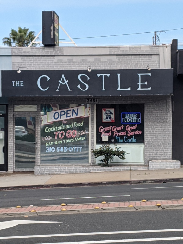 A bar called The Castle offering cocktails to go.