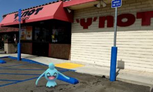 A Wynaut in front of a restaurant called 'Y' Not Burgers