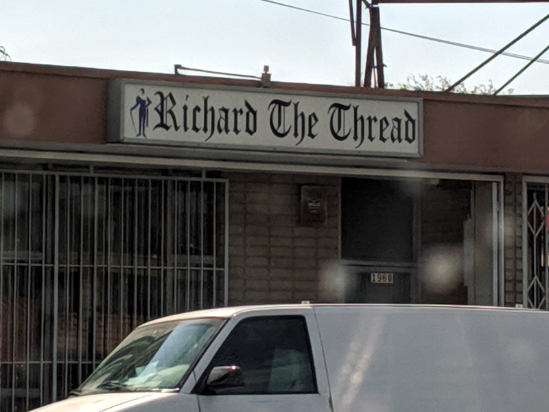 Storefront with a sign saying Richard the Thread on it.