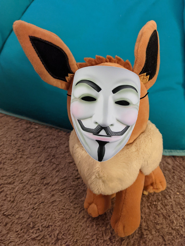 An Eevee plush (Pokemon) with a superimposed Guy Fawkes mask.