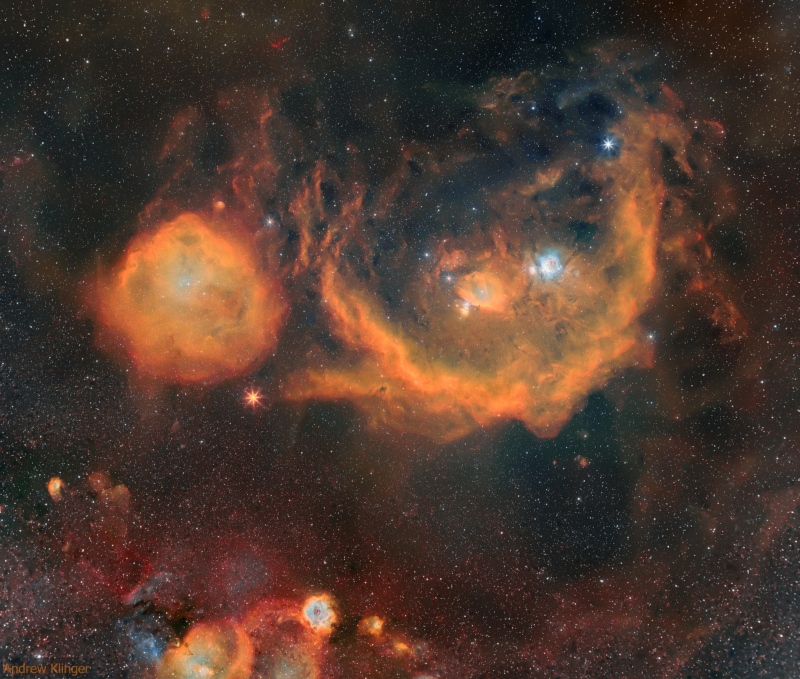 Huge swaths of orange in a night sky view that wraps around the constellation Orion.