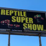 Billboard advertising REPTILE SUPER SHOW with pictures of a snake and...a frog.